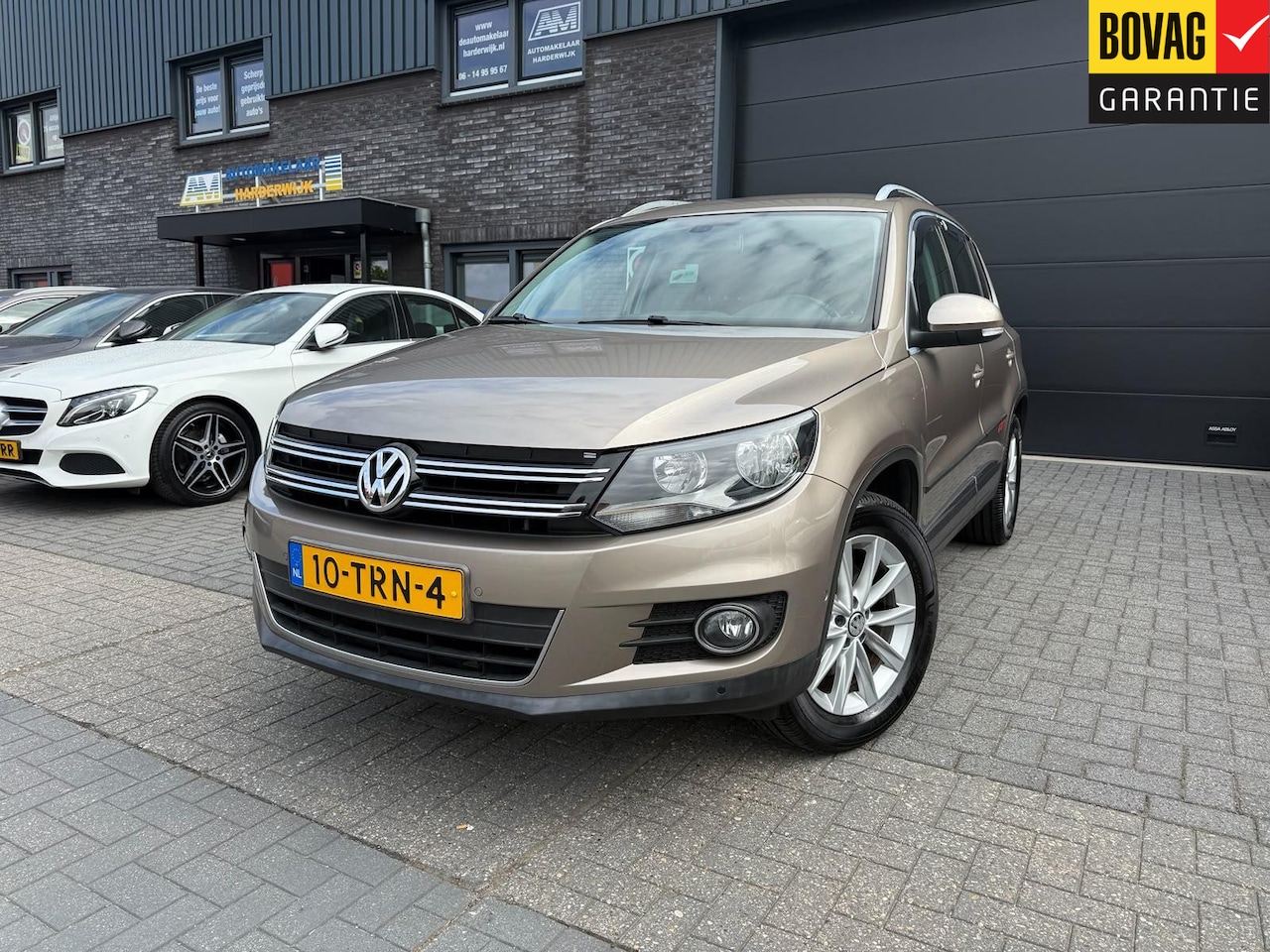 Volkswagen Tiguan - 1.4 TSI Sport&Style | 1E EIGENAAR | 3/6/12MND GARANTIE | NAVI | PDC | 160 PK | LAGE KM | - AutoWereld.nl