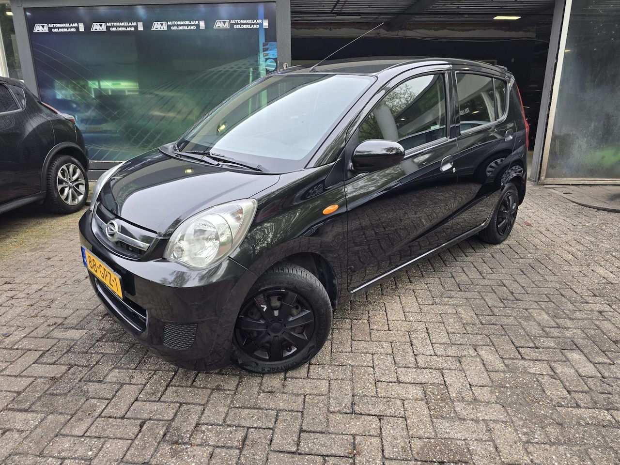 Daihatsu Cuore - 1.0 Premium | 1E EIGENAAR |3/6 OF 12MND GARANTIE | AIRCO | ELEC RAMEN | NW APK | - AutoWereld.nl