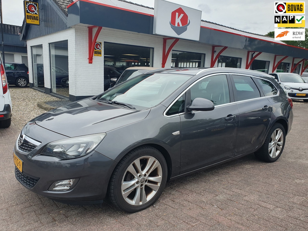 Opel Astra Sports Tourer - 1.4 Turbo Sport LEER/AIRCO BJ 2011 - AutoWereld.nl