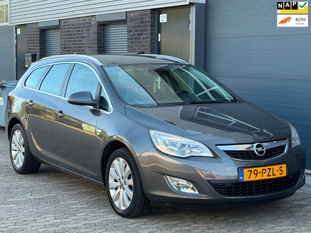 Opel Astra Sports Tourer - 1.4 Cosmo NAVI LEER CLIMA CRUISE TREKHAAK APK NAP - AutoWereld.nl