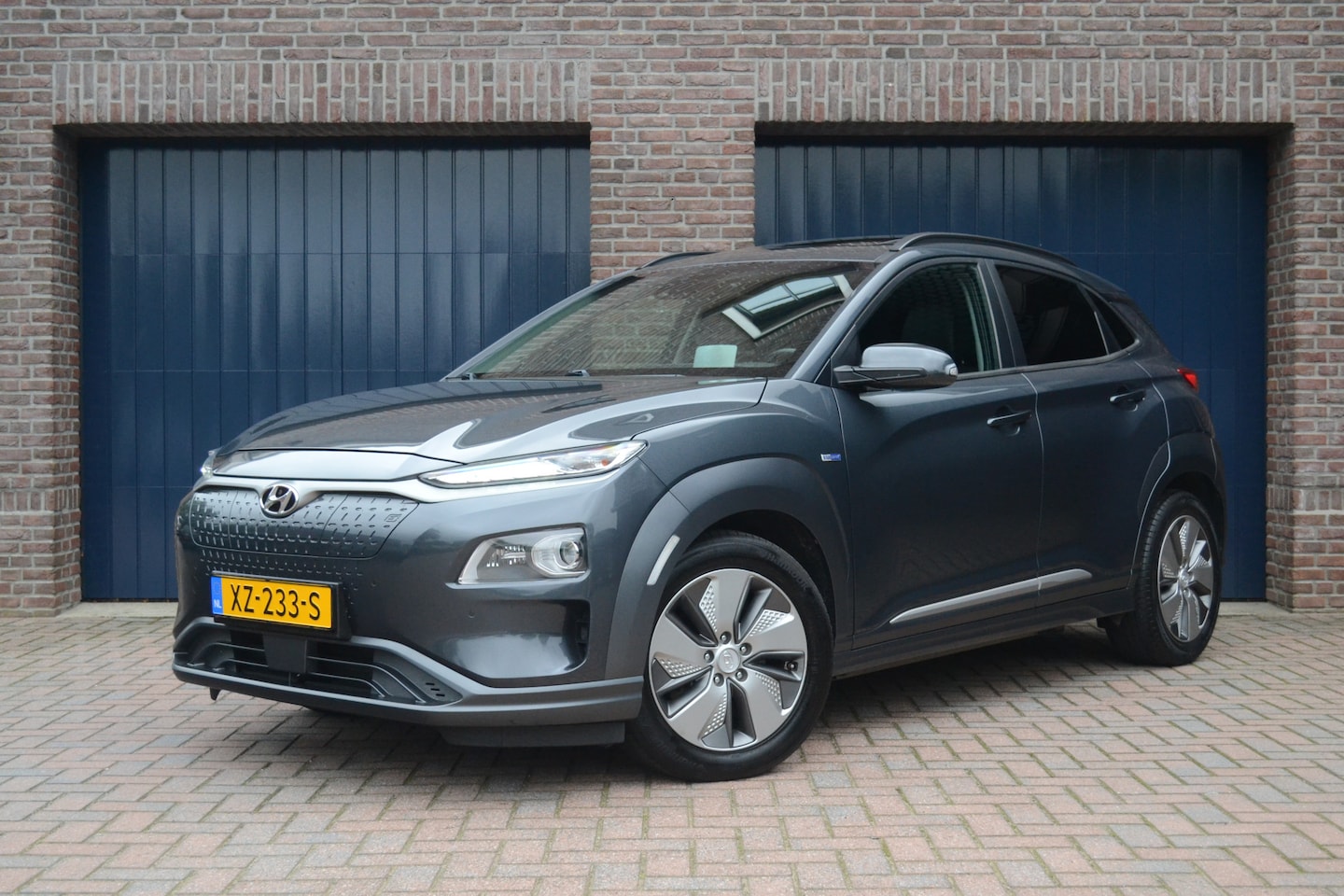 Hyundai Kona Electric - EV Premium 64 kWh | 98% SOH | Schuifdak | Keyless | Stoelventilatie/verwarming | Camera | - AutoWereld.nl