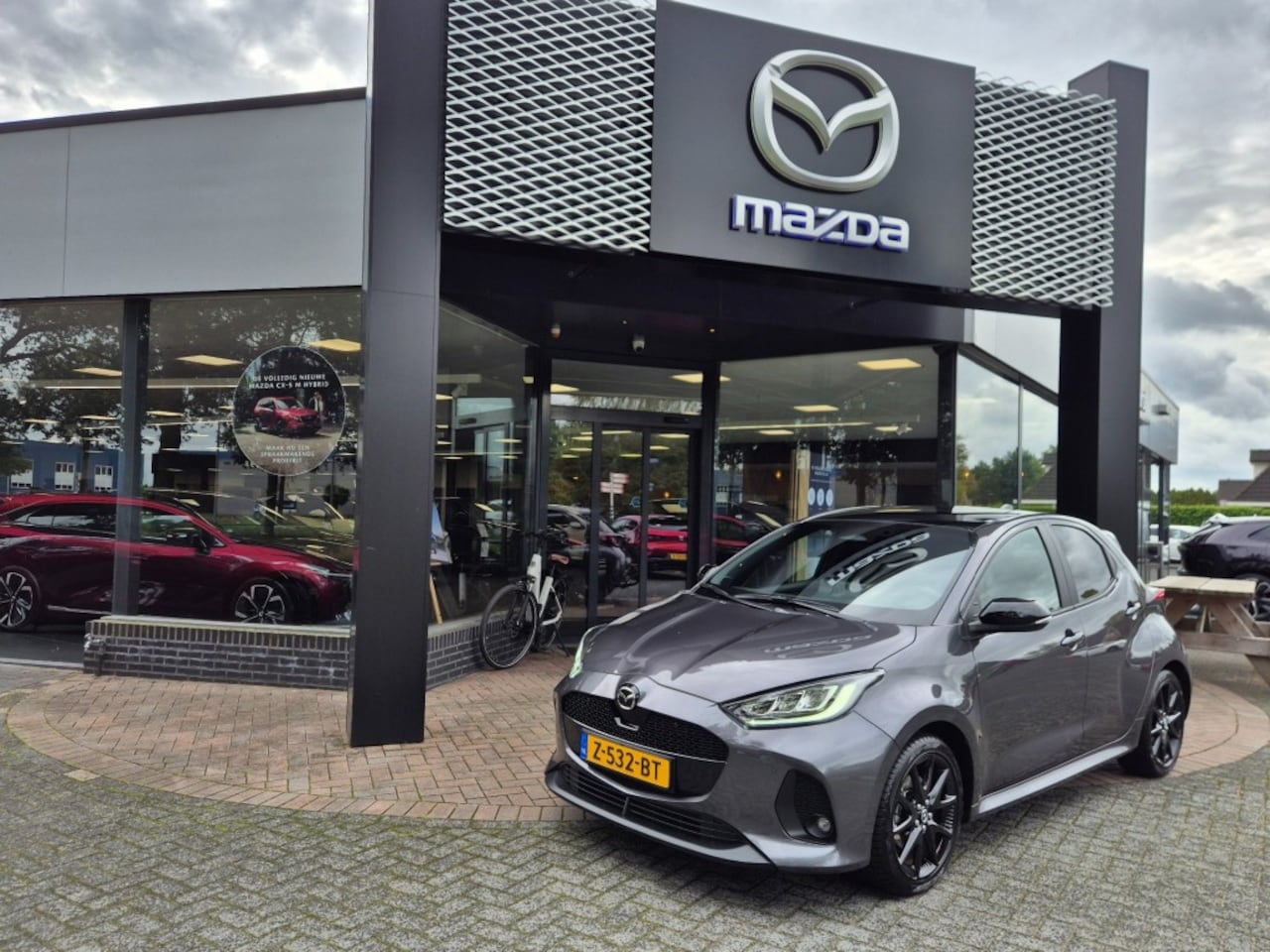 Mazda 2 Hybrid - 2 HYBRID 1.5 116 VVT-i HOMURA PLUS / Trekhaak - AutoWereld.nl