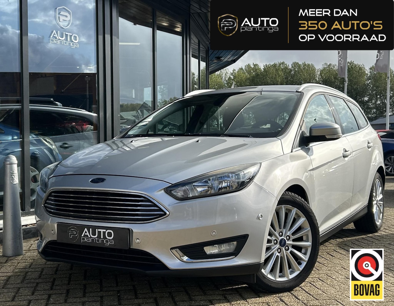 Ford Focus Wagon - 1.0 Titanium 125PK | NL AUTO | NAP | Onderhoudshistorie | Trekhaak | Navigatie | Climate C - AutoWereld.nl