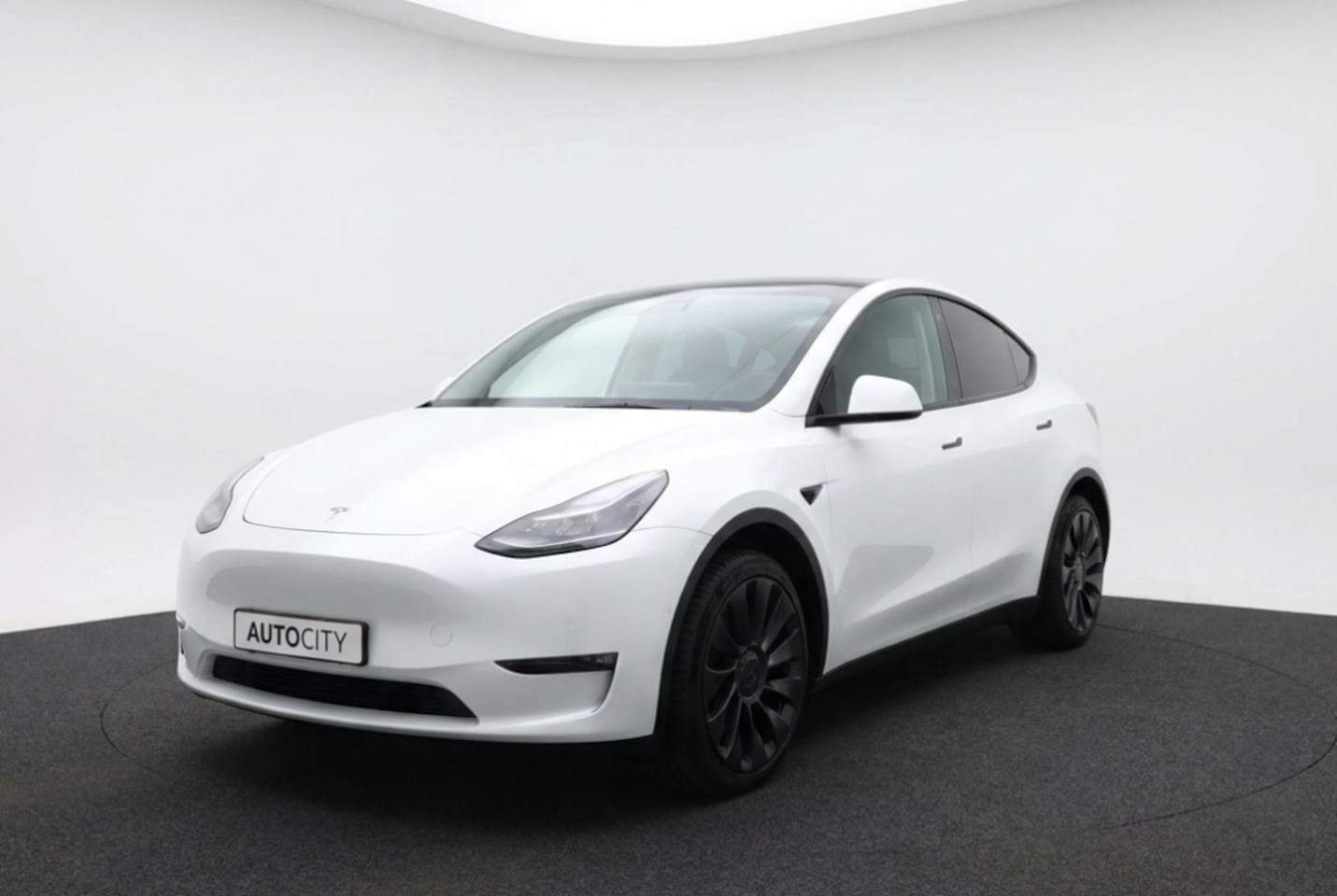 Tesla Model Y - Long Range AWD 75kWh Full Self Driving l Warmtepomp l Trekhaak - AutoWereld.nl