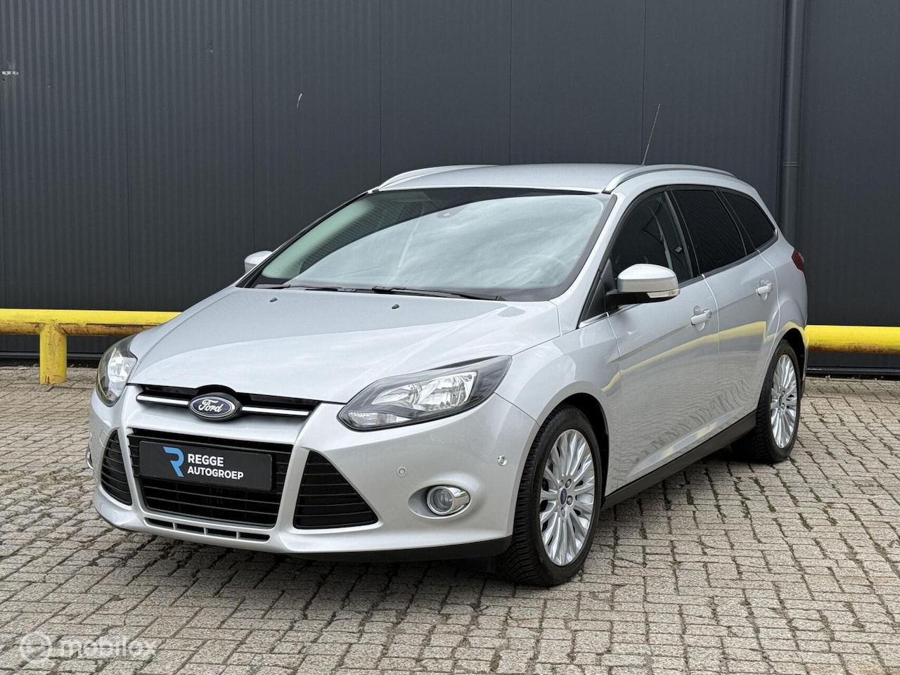 Ford Focus Wagon - 1.0 EcoBoost Titanium PDC | NIEUWSTAAT - AutoWereld.nl