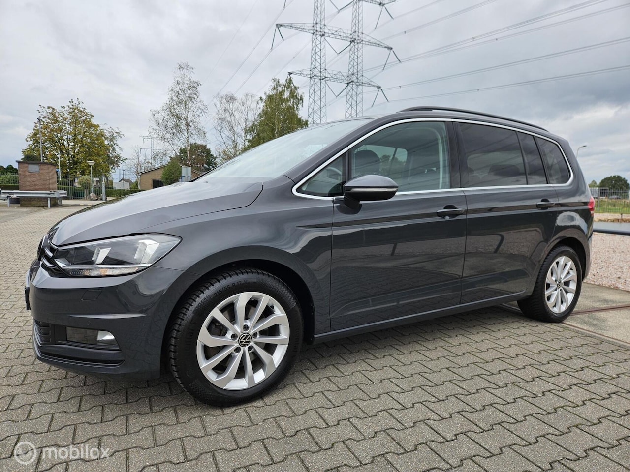 Volkswagen Touran - 1.5 TSI Highline 7p/automaat/alle optie's - AutoWereld.nl