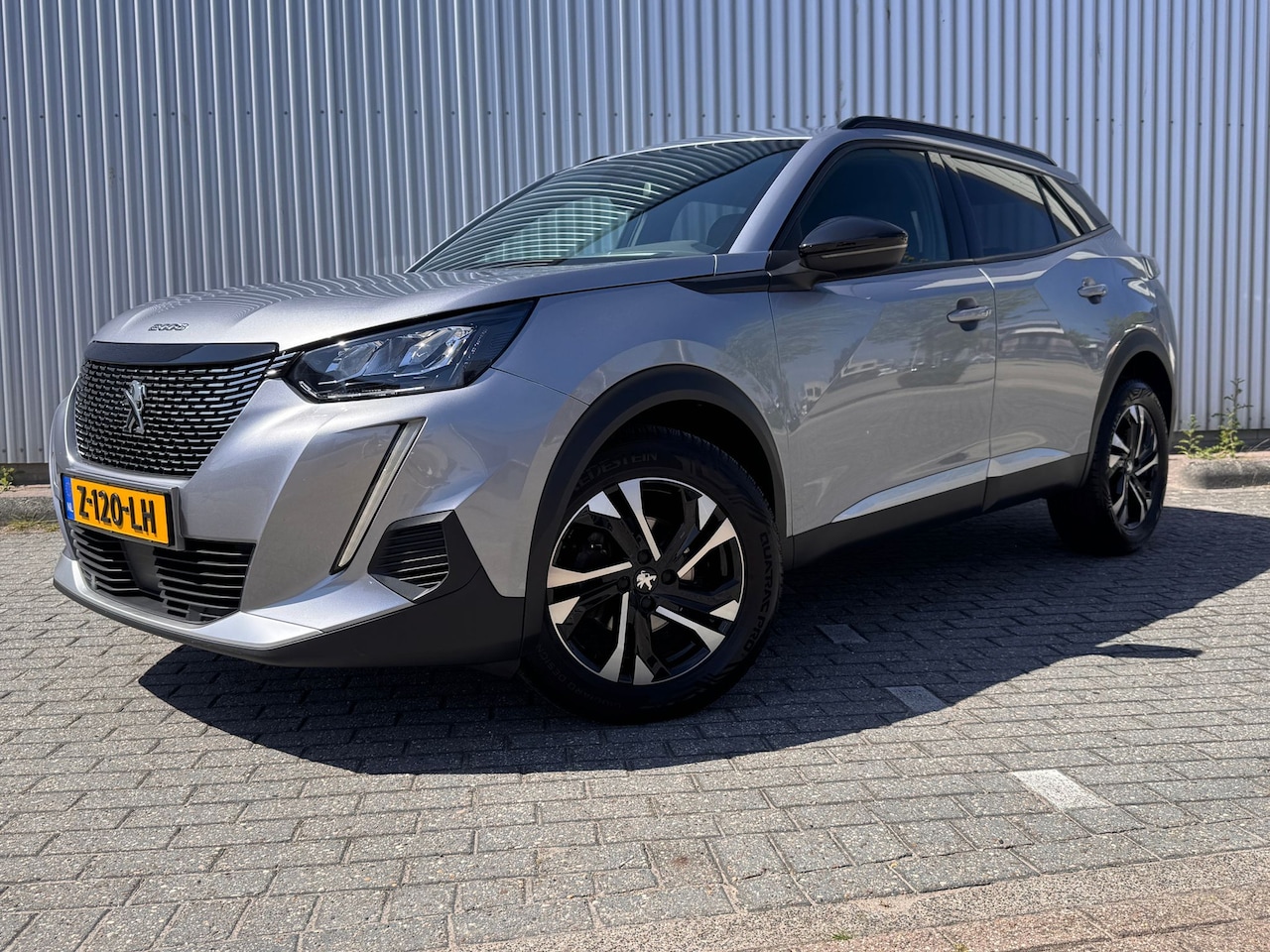 Peugeot 2008 - 1.2 100PK Allure Pack | Navigatie | Apple Carplay / Android Auto | Cruise Control | Parkee - AutoWereld.nl