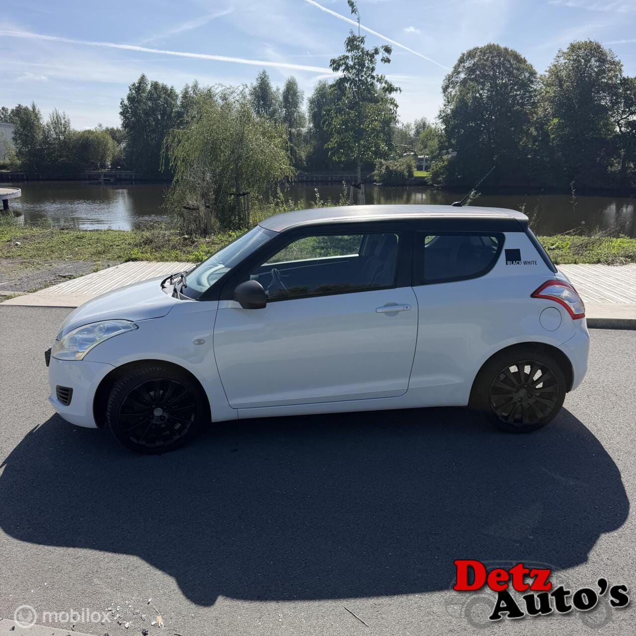Suzuki Swift - black & wite uitvoering,parelmoer,airco - AutoWereld.nl