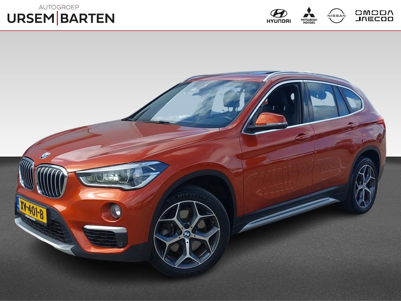 BMW X1 - sDrive20i Orange Edition III | Trekhaak met afneembare kogel - AutoWereld.nl