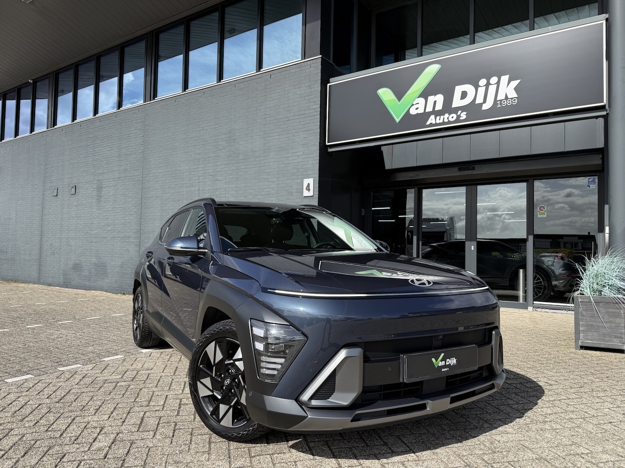 Hyundai Kona - 1.6 GDI HEV Premium Sky Open Dak Navi Camera Leer - AutoWereld.nl