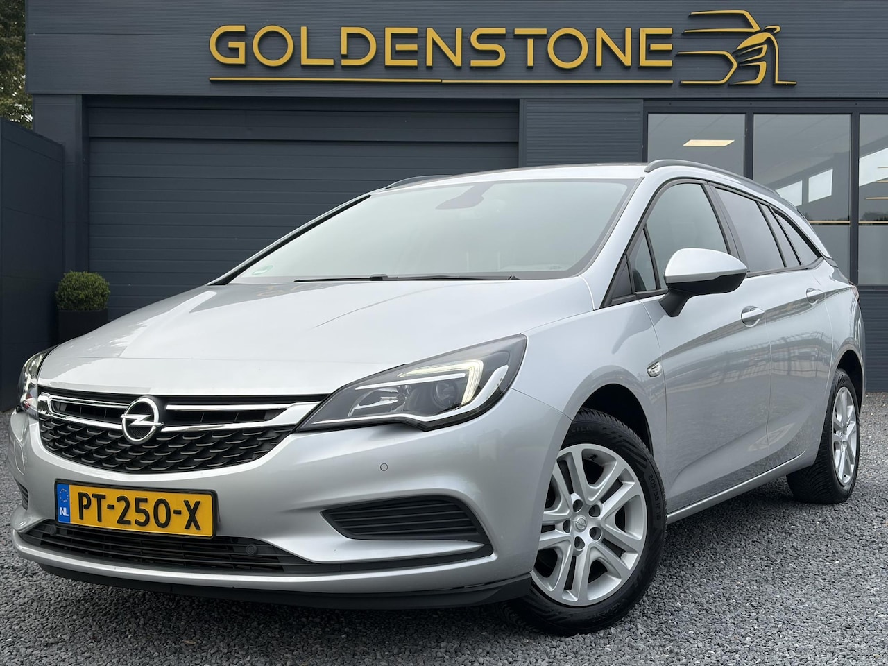 Opel Astra Sports Tourer - 1.0 Online Edition ✓2e Eigenaar✓Carplay✓Navi✓Trekhaak✓Net beurt gehad✓Clima✓Cruise✓Pdc V+A - AutoWereld.nl