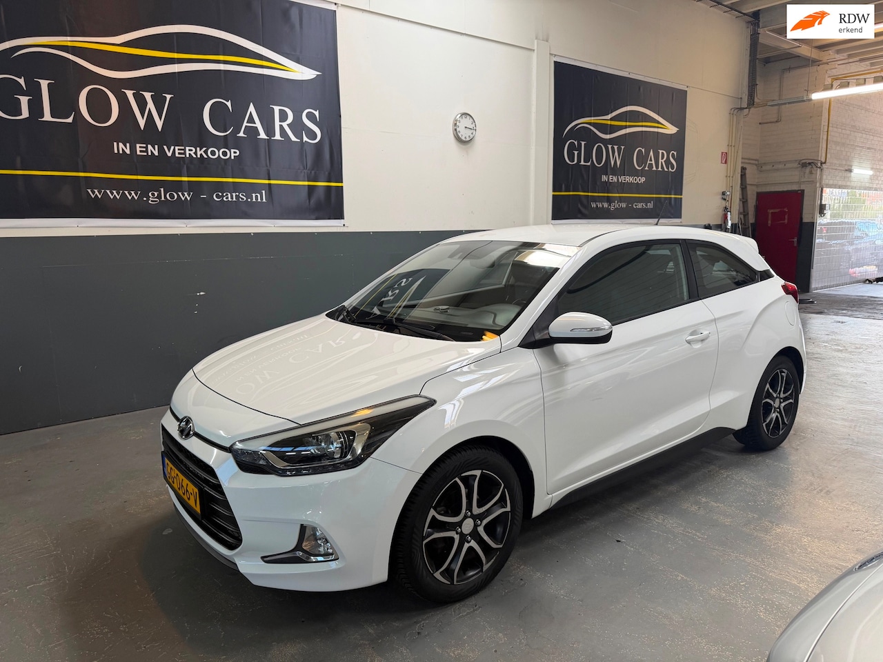 Hyundai i20 Coupé - 1.2 HP i-Motion Comfort |AIRCO|AUX|CRUISE|PDC - AutoWereld.nl