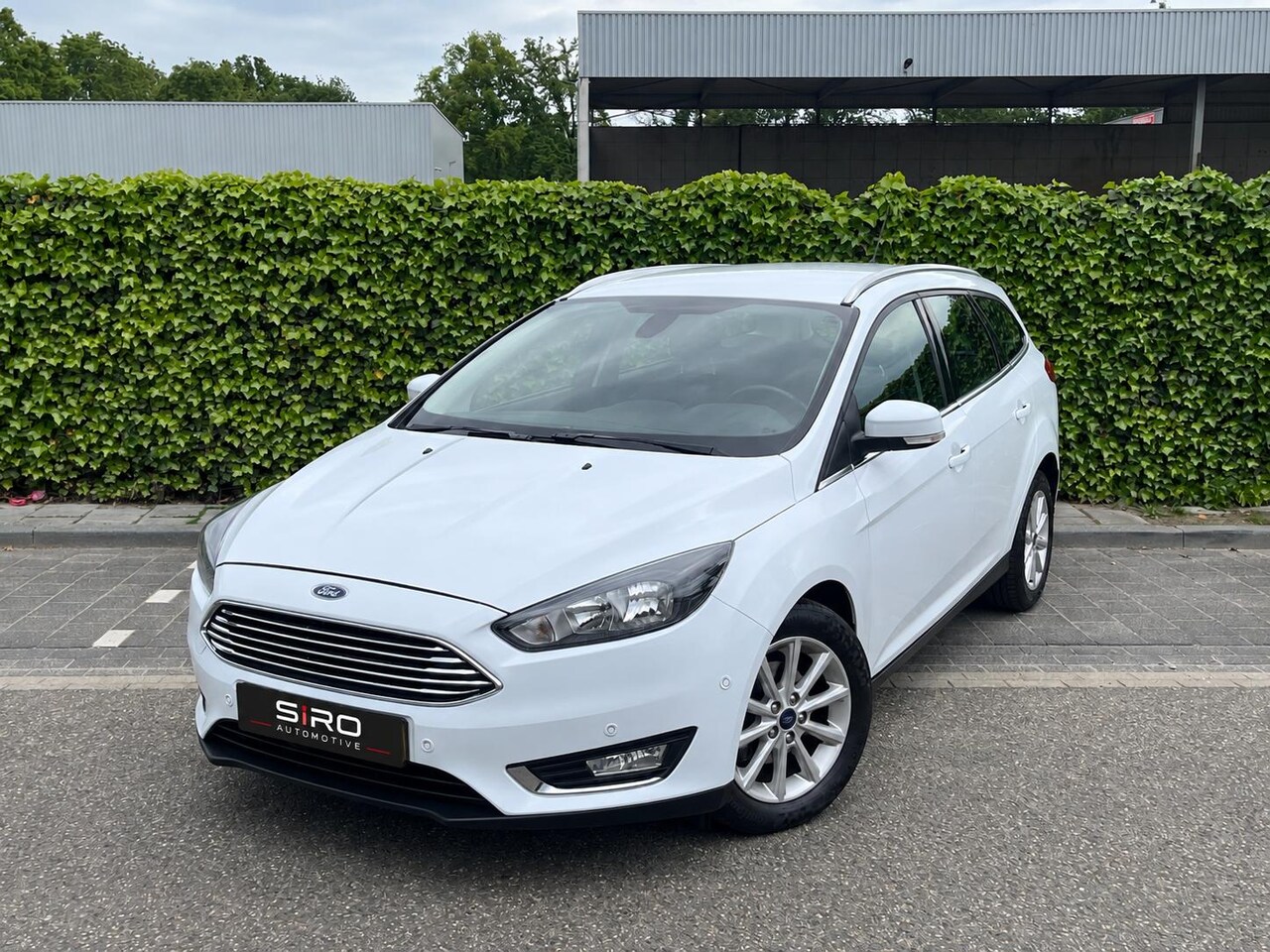Ford Focus Wagon - 1.0 Titanium * Navi * Nieuwe Distr. * Garantie - AutoWereld.nl