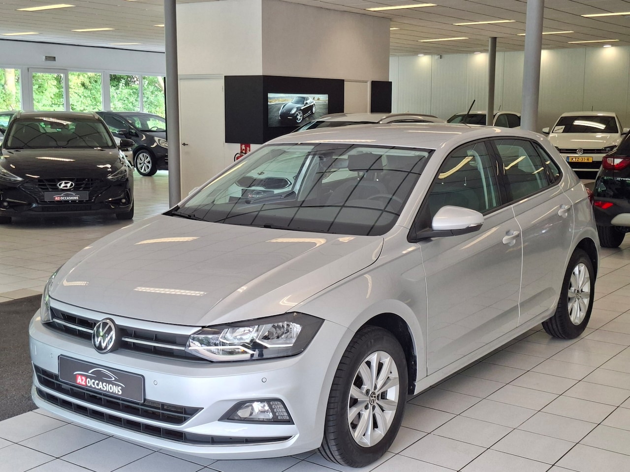 Volkswagen Polo - 1.0 TSI Highline Navi/Bluetooth/Parkeersensoren voor en achter - AutoWereld.nl