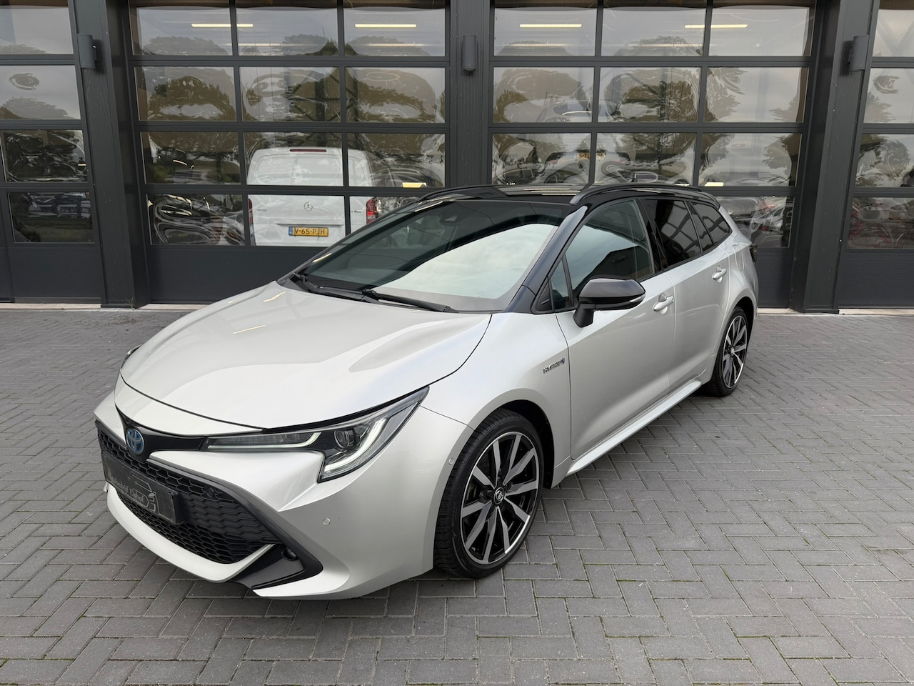 Toyota Corolla Touring Sports - 1.8 Hybrid | ACC | Navi | LED - AutoWereld.nl