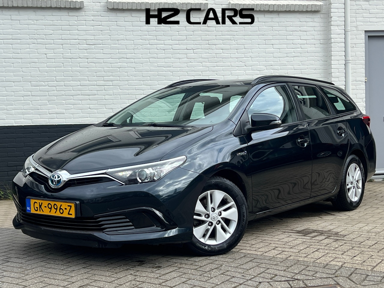 Toyota Auris Touring Sports - 1.8 Hybrid Now|Trekhaak|Camera|Cruise|Clima - AutoWereld.nl