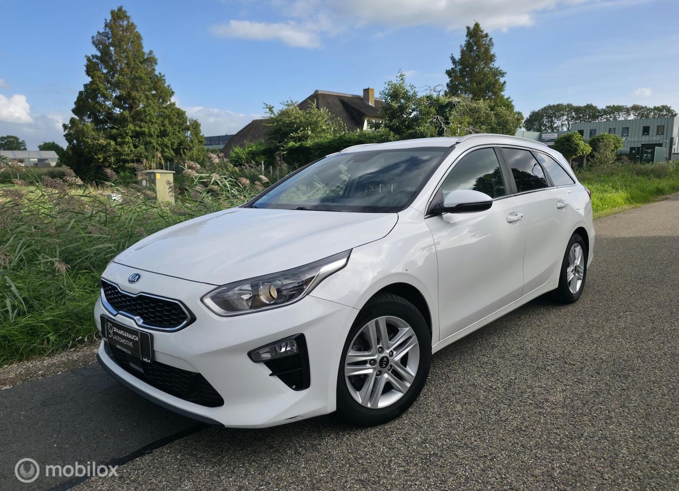 Kia Cee'd Sportswagon - Ceed 1.0 T-GDi / Trekh. / Navi / Half leder - AutoWereld.nl