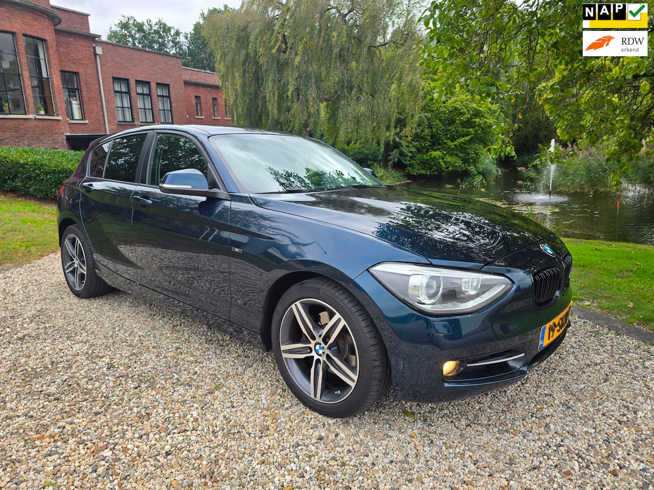 BMW 1-serie - 118i Business 5-deurs AUTOMAAT/xenon/NAVI - AutoWereld.nl