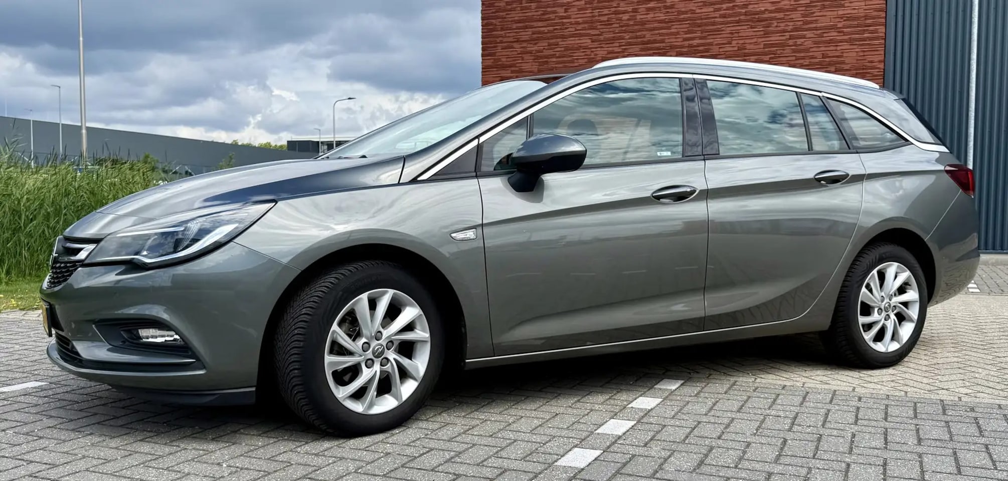 Opel Astra Sports Tourer - 1.0 Business Executive Astra 1.0 Business Ex. TURBO Apple CarPlay/Android Auto| Keyless | Elektr. achterklep | Cl - AutoWereld.nl