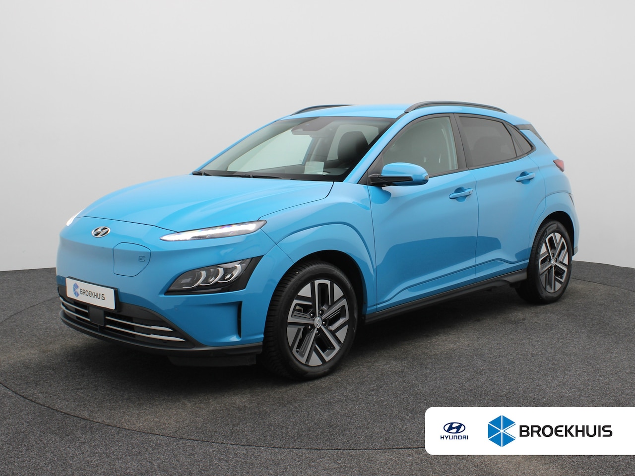 Hyundai Kona Electric - Premium 64 kWh | Achteruitrijcamera | Airco (automatisch) | Bagagedek - AutoWereld.nl