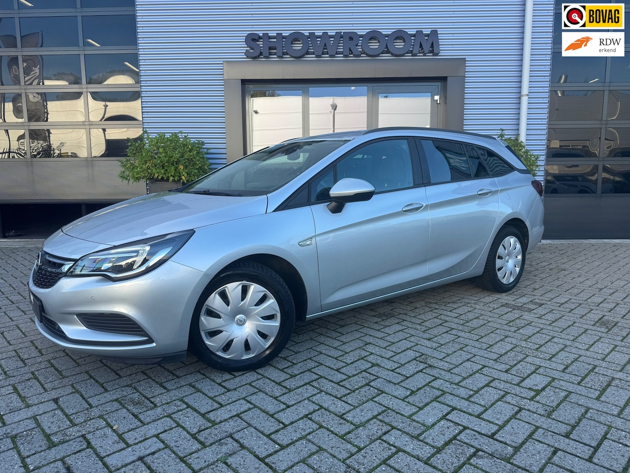 Opel Astra Sports Tourer - 1.4 Online Edition|AUTOMAAT|TREKHAAK|CRUISE|NAVI|STOEL&STUURVERWARMING - AutoWereld.nl