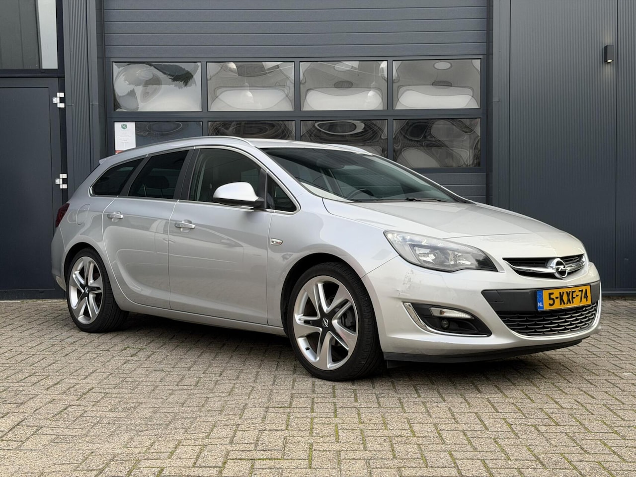 Opel Astra Sports Tourer - 1.4 Turbo | Airco | Cruise - AutoWereld.nl