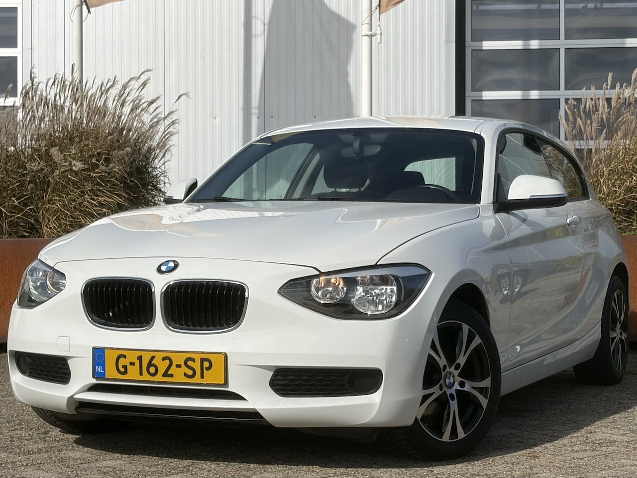 BMW 1-serie - 114i EDE 101pk | Airco | Bluetooth | Isofix bevestiging voor kinderzitjes | Radio cd spele - AutoWereld.nl