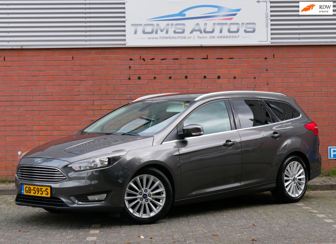 Ford Focus Wagon - 1.0 Titanium Edition nieuwe distributie. camera. navi. clima - AutoWereld.nl