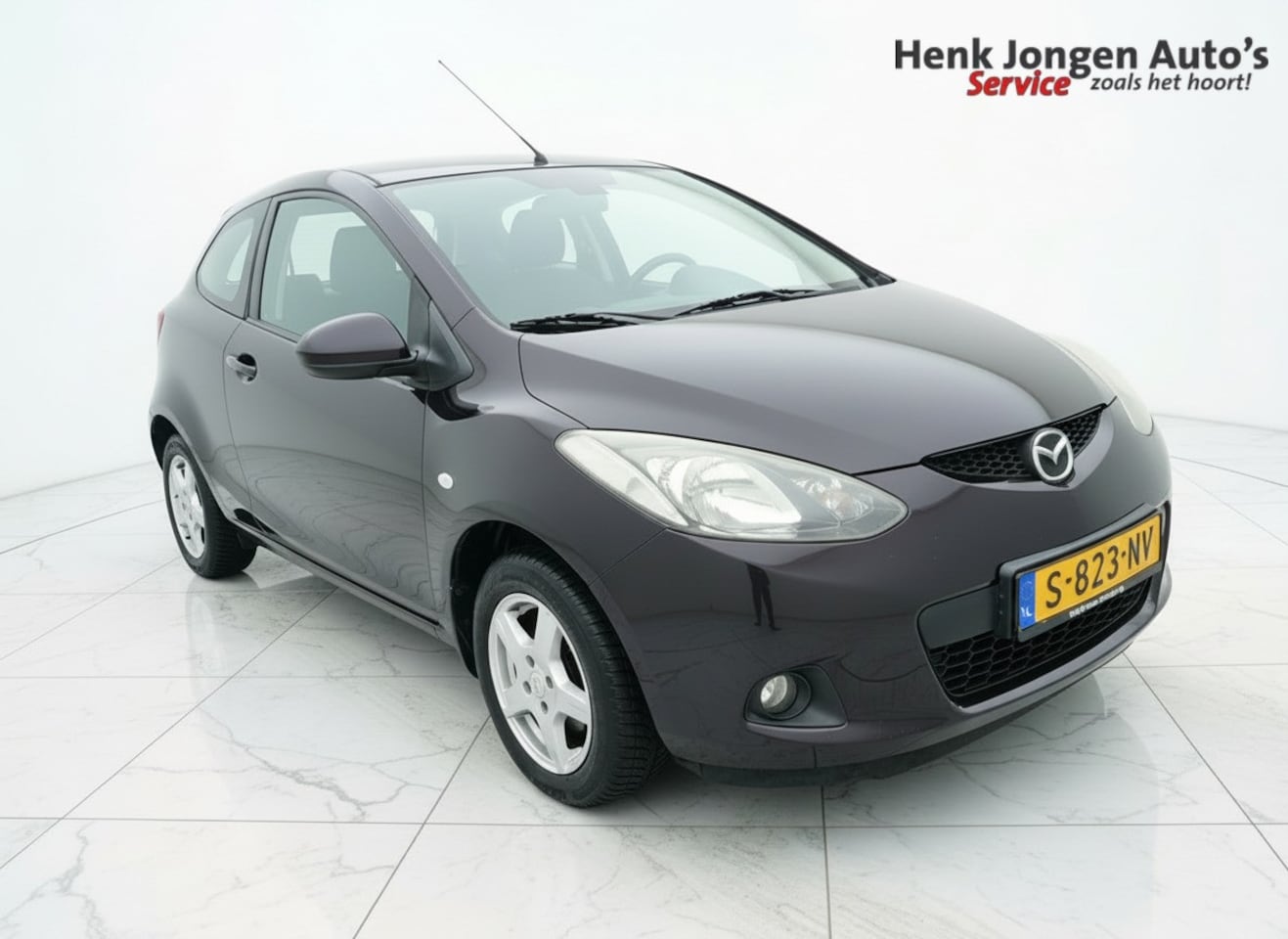 Mazda 2 - 1.3 TS Plus  “Sinds 1970 | 5.000+ reviews | Score 9,5 | Service zoals ’t hoort” Henk Jonge - AutoWereld.nl