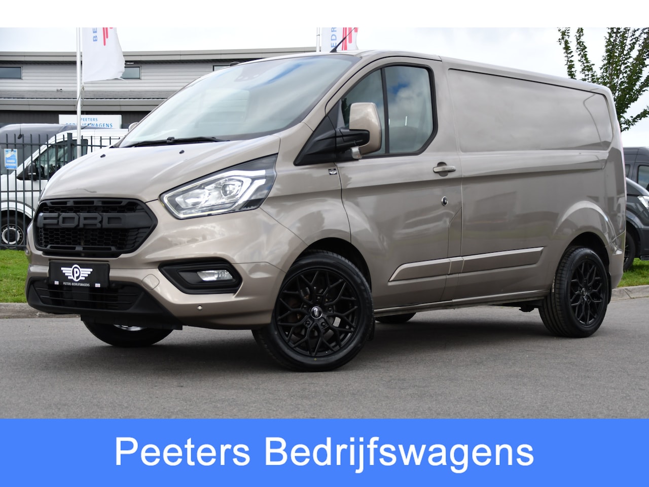 Ford Transit Custom - 280 2.0 TDCI L1H1 PB Edition Limited Camera, Cruise, Carplay, Stoelverwarming, Trekhaak, 1 - AutoWereld.nl