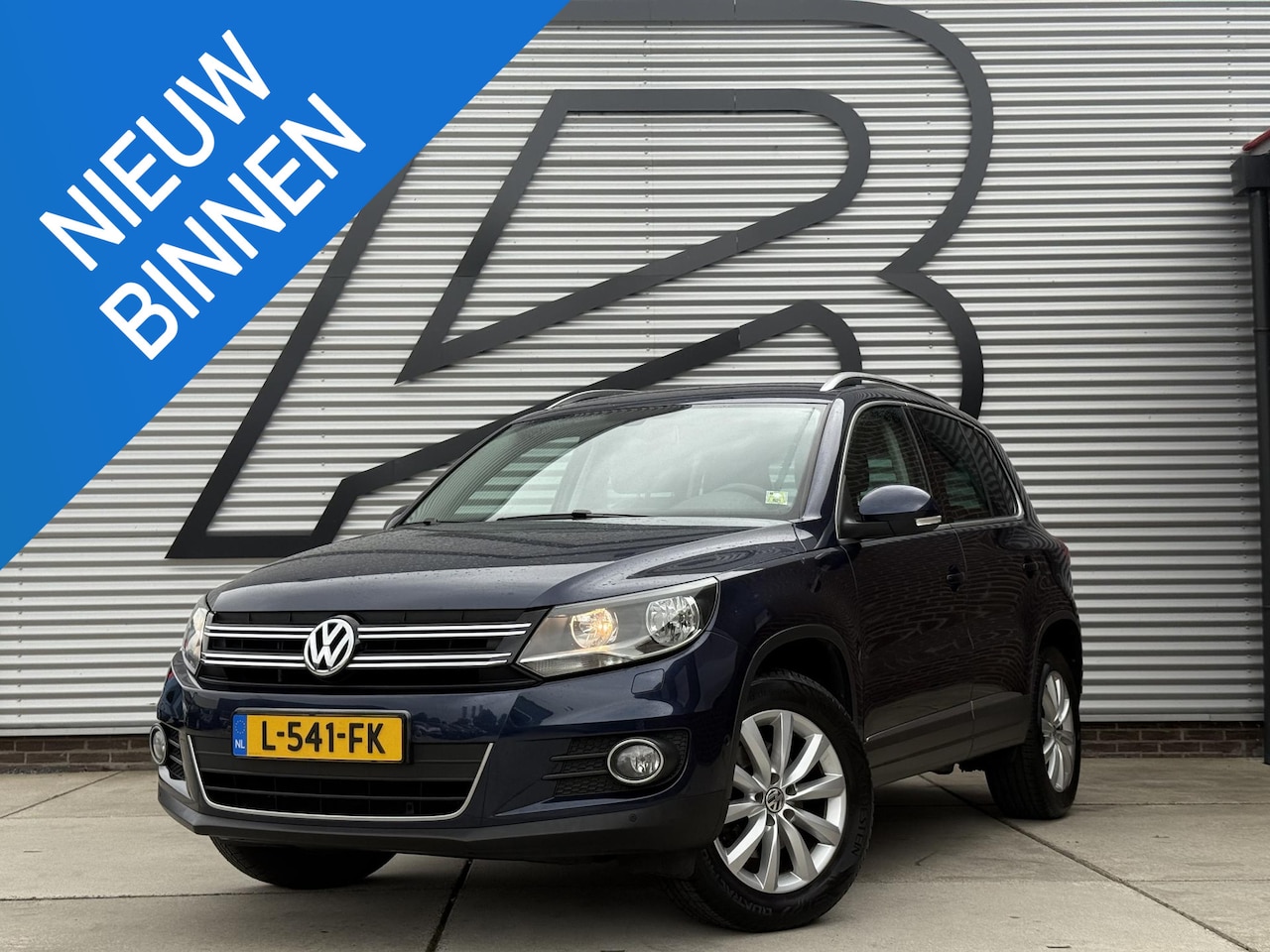 Volkswagen Tiguan - 1.4 TSI Sport&Style 2e Eigenaar|Navi|Leder|Stoelverwar|Cruise|PDC V+A|Goed Onderhouden|APK - AutoWereld.nl