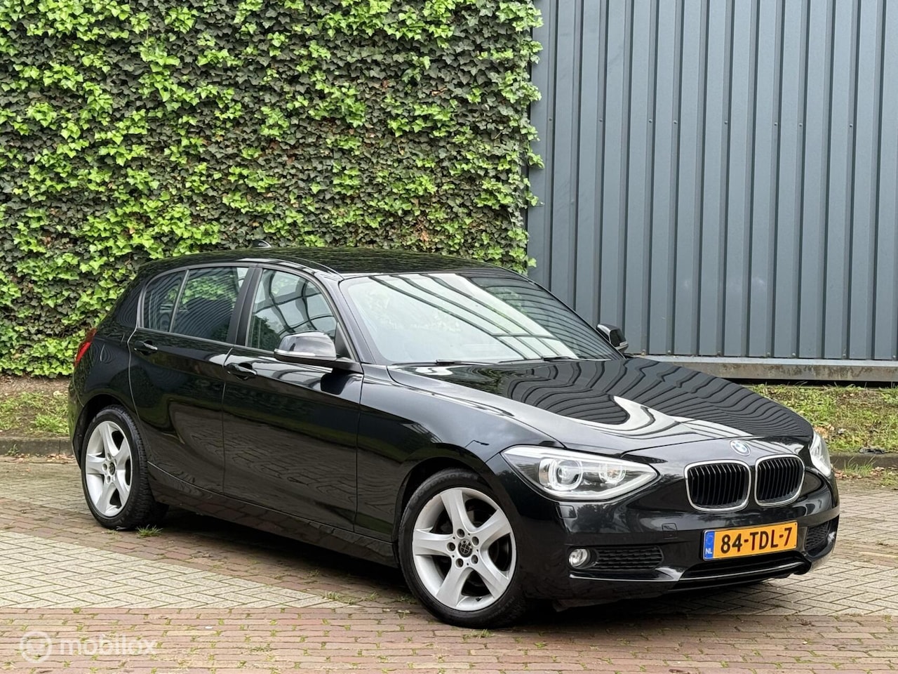 BMW 1-serie - 116i Business+ |Cruise|Trekhaak|Xenon/Led|Clima - AutoWereld.nl