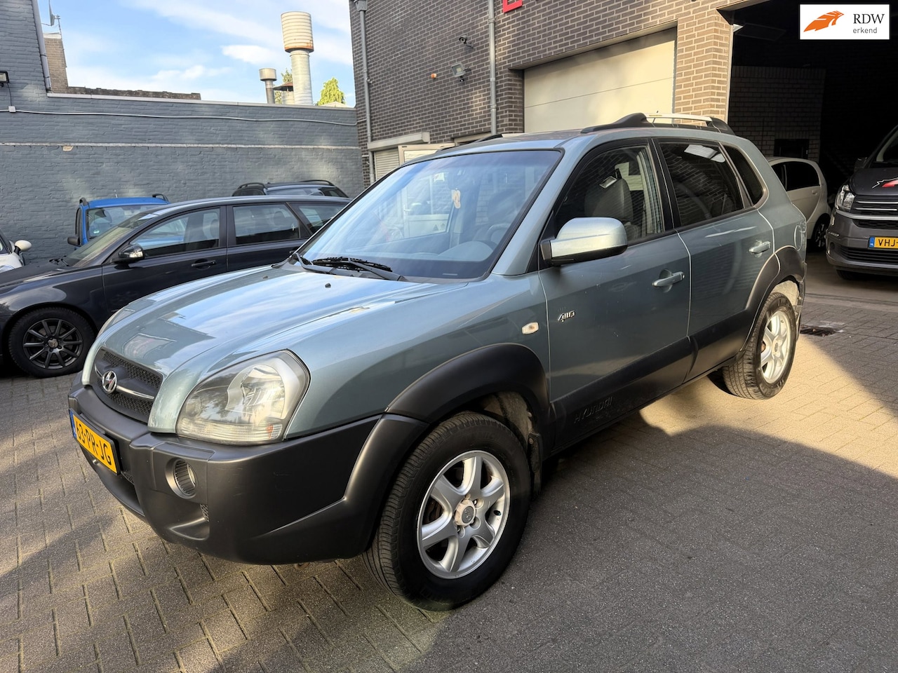 Hyundai Tucson - 2.7i V6 4WD Style 2.7i V6 4WD Style - AutoWereld.nl
