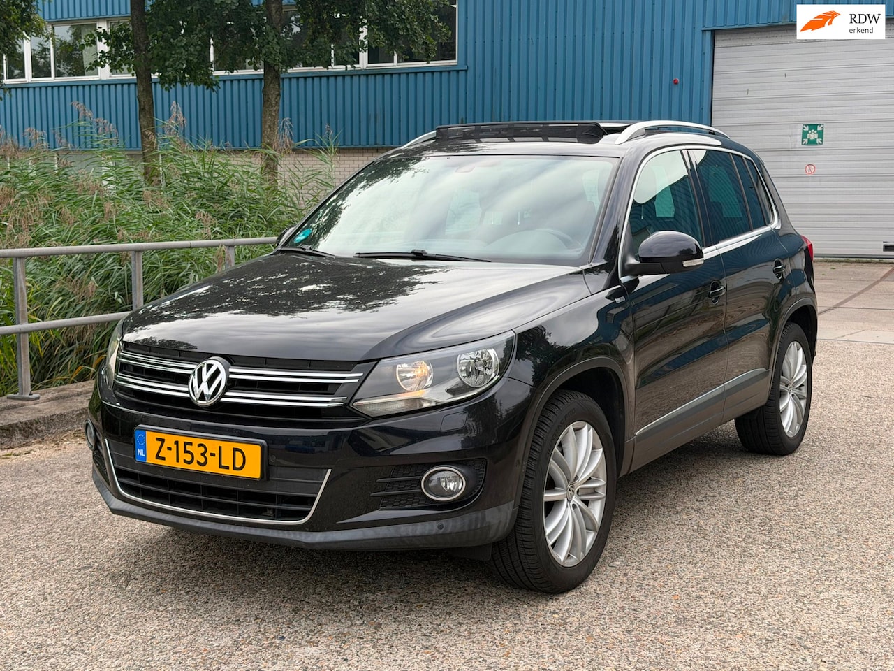 Volkswagen Tiguan - 1.4 TSI Comfort&Design Facelift! PANO! NAVI! PDC! - AutoWereld.nl