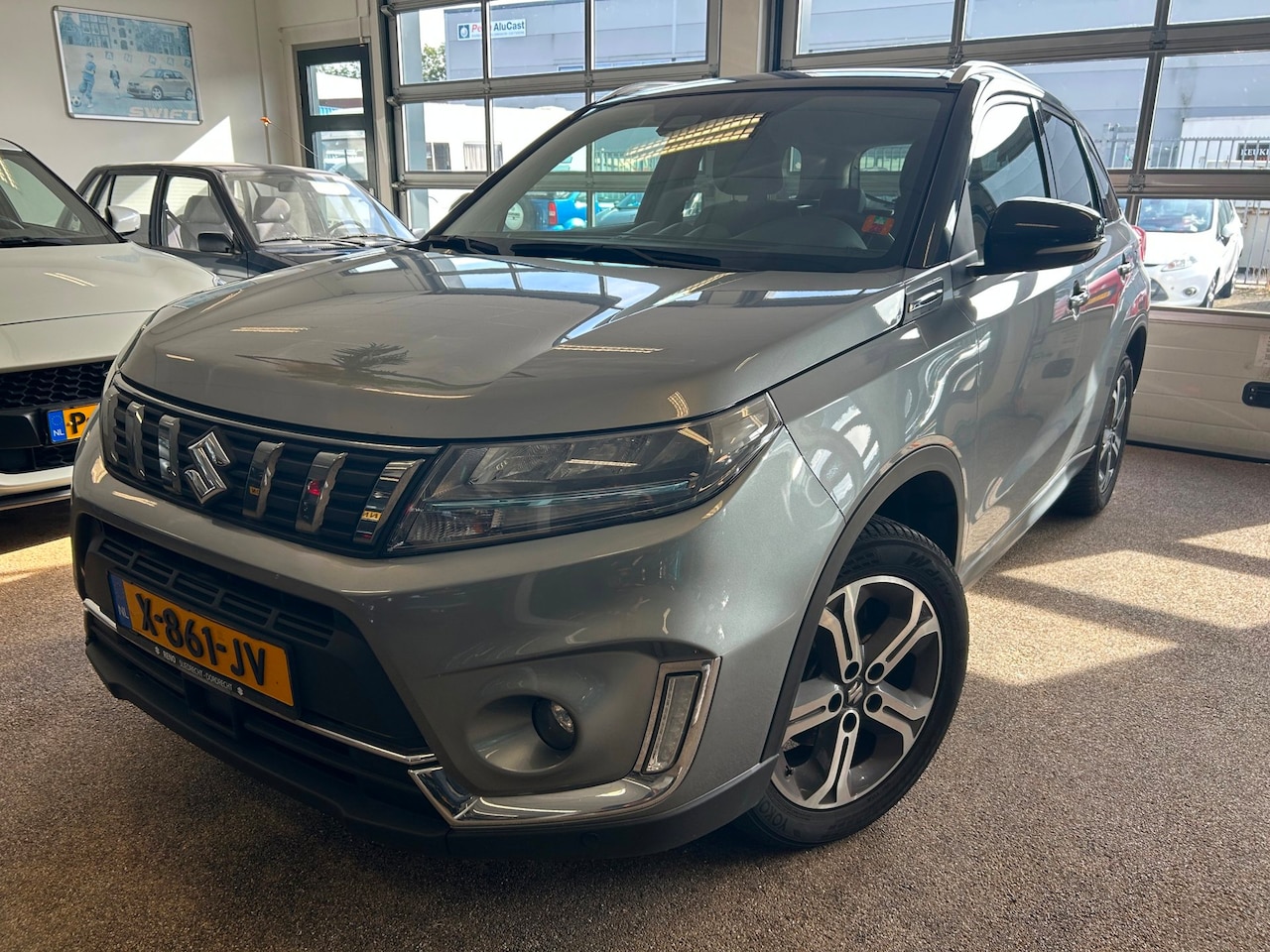 Suzuki Vitara - 1.4 Boosterjet Style Smart Hybrid| Carplay| All Season| 10 jaar garantie! - AutoWereld.nl