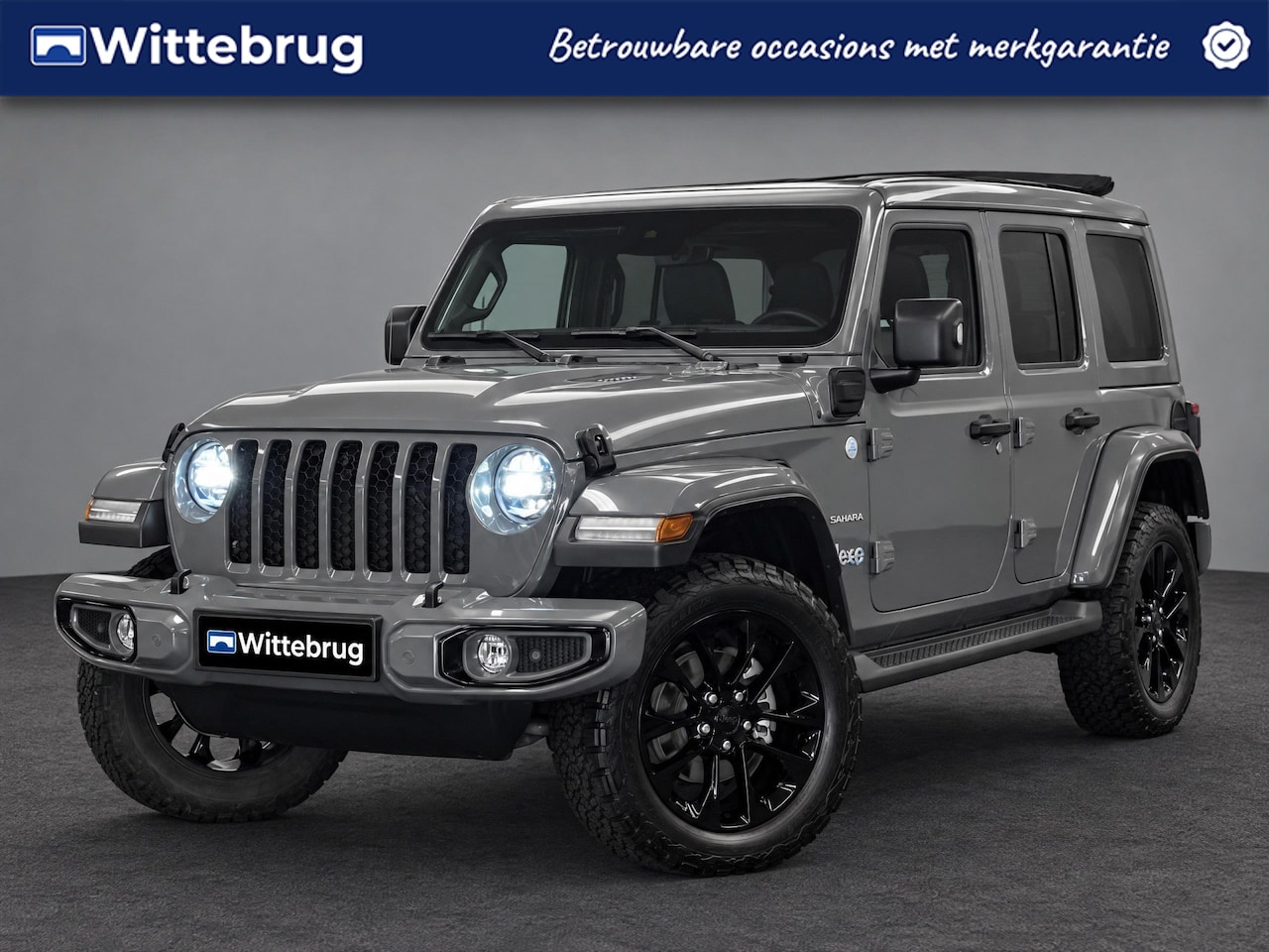 Jeep Wrangler Unlimited - 4xe 380 PHEV Sahara | Camera | Leder | Navigatie | - AutoWereld.nl