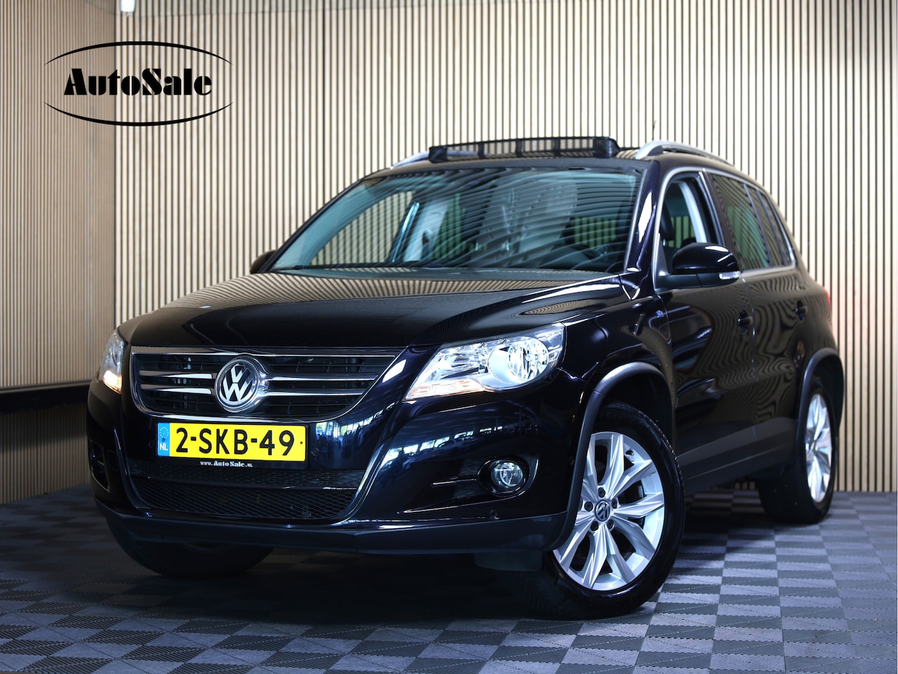 Volkswagen Tiguan - 1.4 TSI PANO NAVI CRUISE CLIMA PARROT PDC LEDER PARK ASSIST'10 - AutoWereld.nl