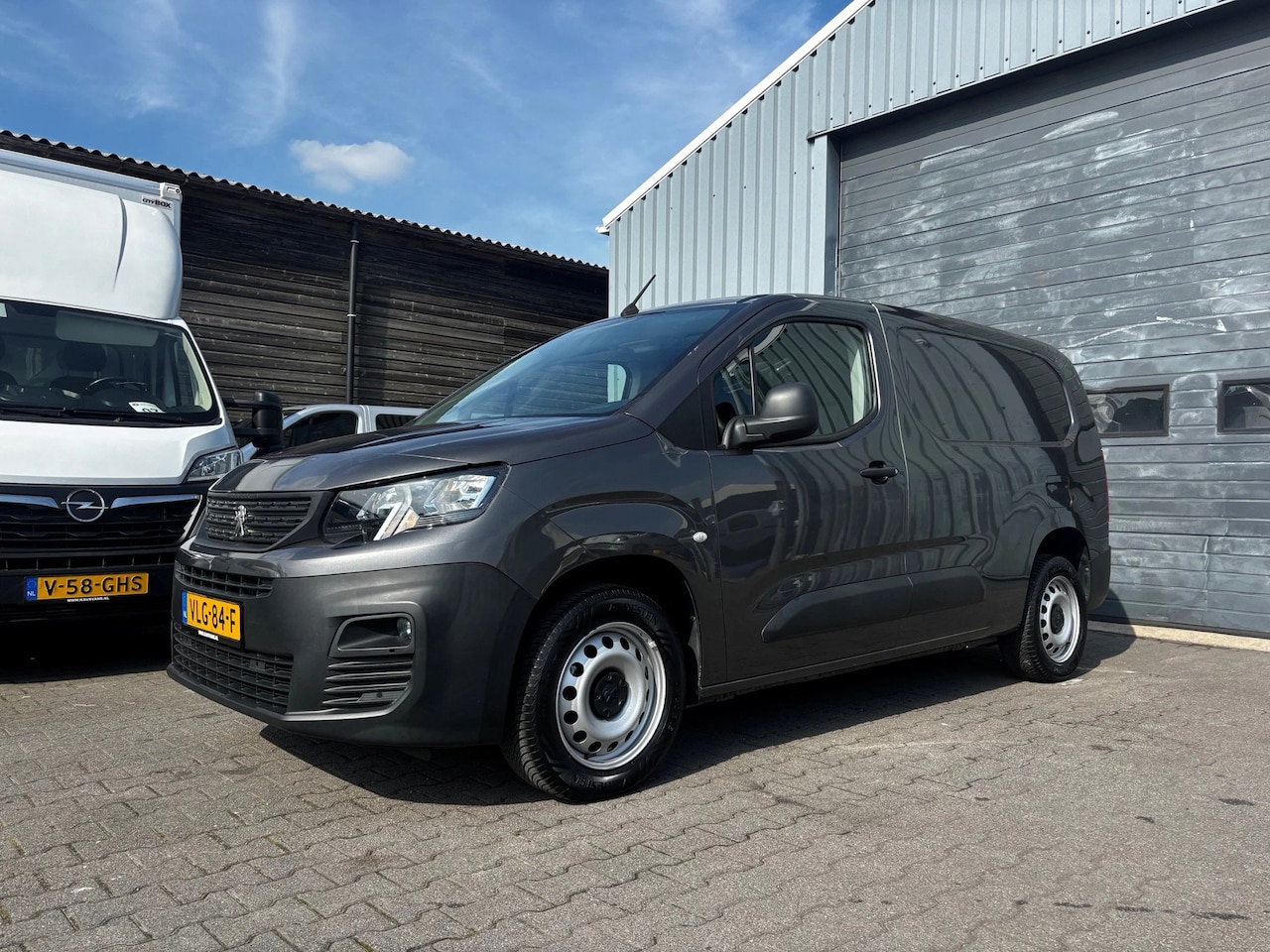 Peugeot Partner - 1.5 BlueHDI L2 Airco Navi Trekhaak - AutoWereld.nl