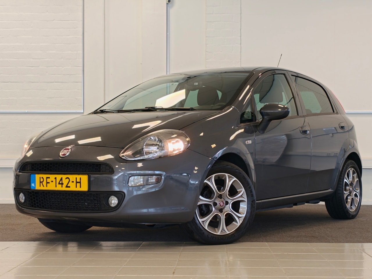 Fiat Punto Evo - 0.9 TwinAir Sempre Cruise Clima Navi Trekhaak 16''LM - AutoWereld.nl