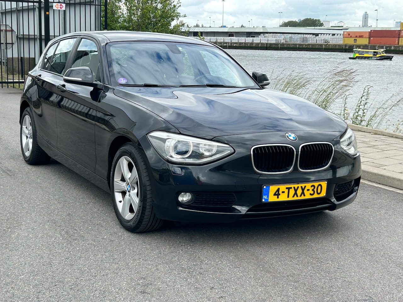 BMW 1-serie - 116i High Executive 136 PK AUT LED NAVI PDC ECC - AutoWereld.nl