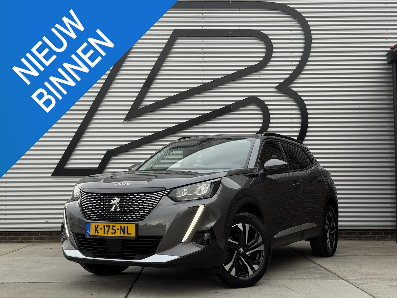 Peugeot 2008 - 1.2 PureTech Blue Lease Allure 2e Eigenaar|Navi|Camera|D-riem vv in 2025|i-Cockpit|Trekhaa - AutoWereld.nl