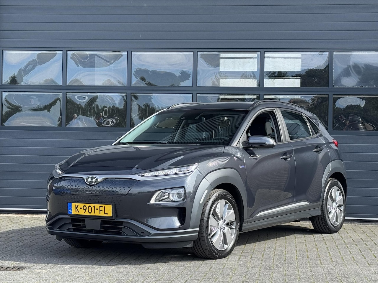 Hyundai Kona Electric - EV COMFORT 64 kWh (100% SOH) I AUTOMAAT I P-CAMERA I APPLE CARPLAY I CRUISE CONTROL - AutoWereld.nl