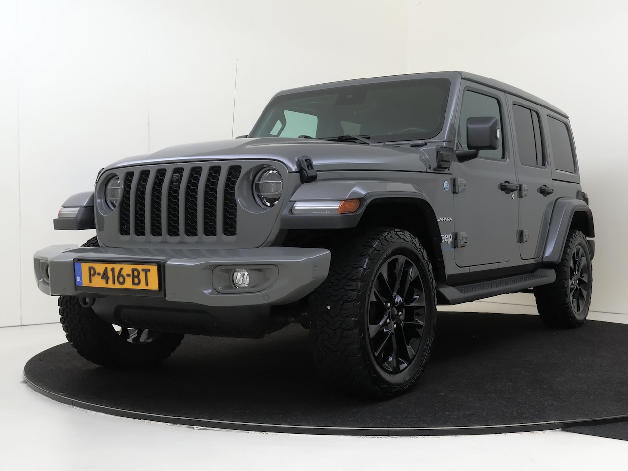 Jeep Wrangler Unlimited - 4xe 380 PHEV Sahara | Camera | Leder | Navigatie | - AutoWereld.nl