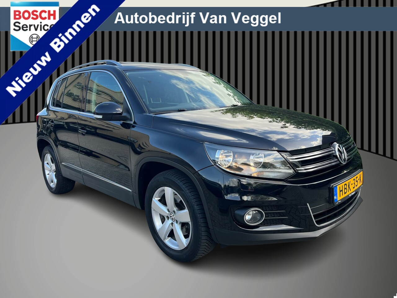 Volkswagen Tiguan - 1.4 TSI Sport&Style cruise, airco, pano, navi - AutoWereld.nl