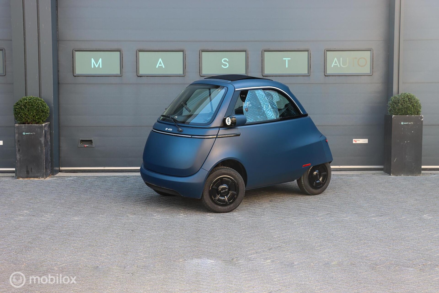 Microlino Microlino - Competizione 10.5 kWh L7 177 Km. 90 KM/U|BTW|FOLDING ROOF|DIRECT LEVERBAAR - AutoWereld.nl