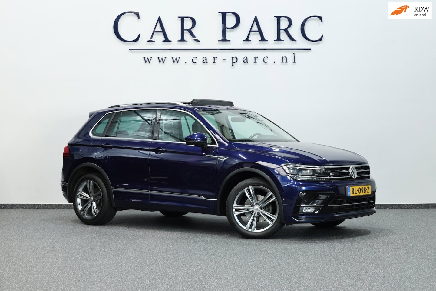 Volkswagen Tiguan - 1.4 TSI ACT R-line LED/VIRTUAL/LEER+S.VERWARMING/LMV/CAM/LINE/ACC/ECC/12 MND GARANTIE! - AutoWereld.nl