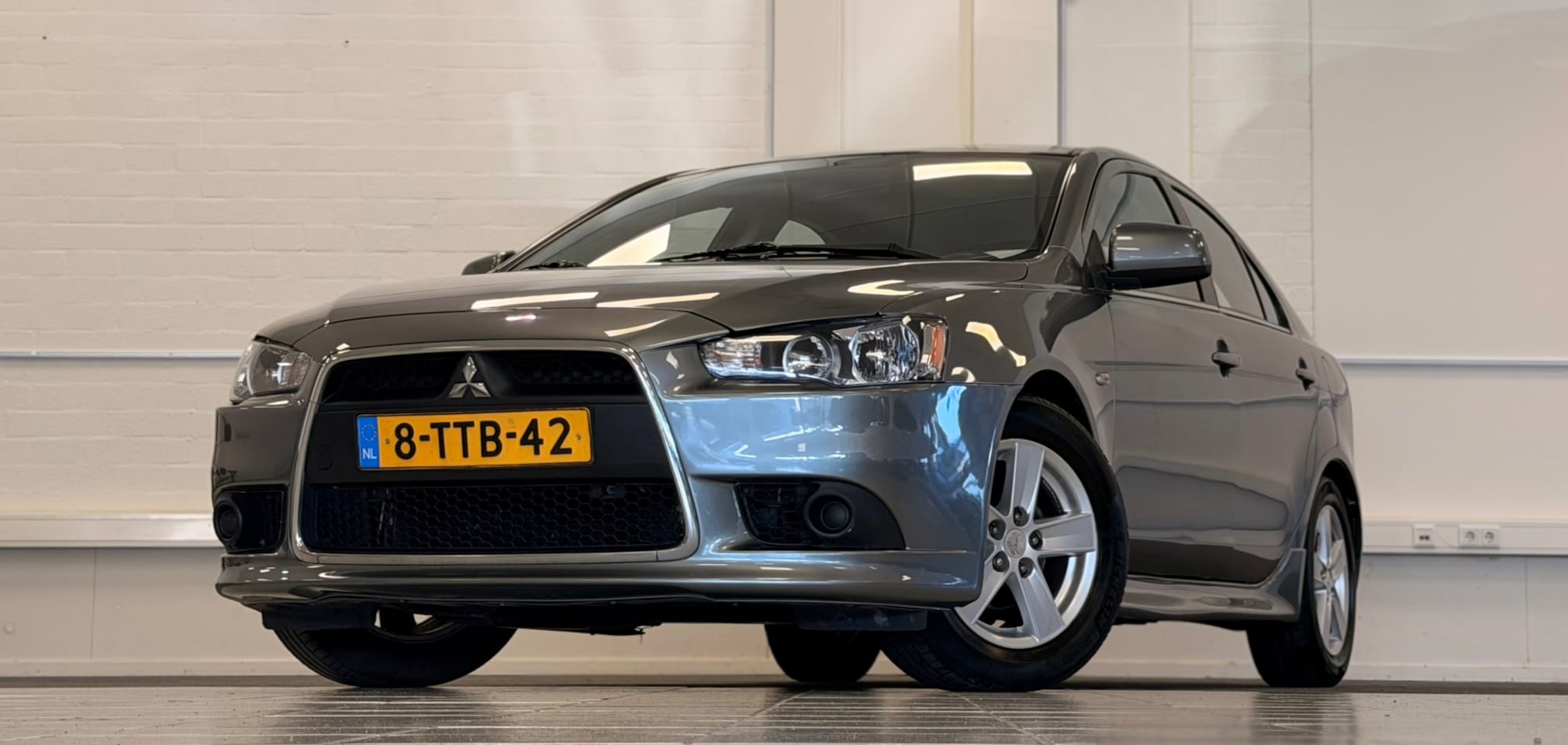 Mitsubishi Lancer Sportback - 1.6 Limited Edition Nieuw staat Trekhaak Parkeerhulp - AutoWereld.nl