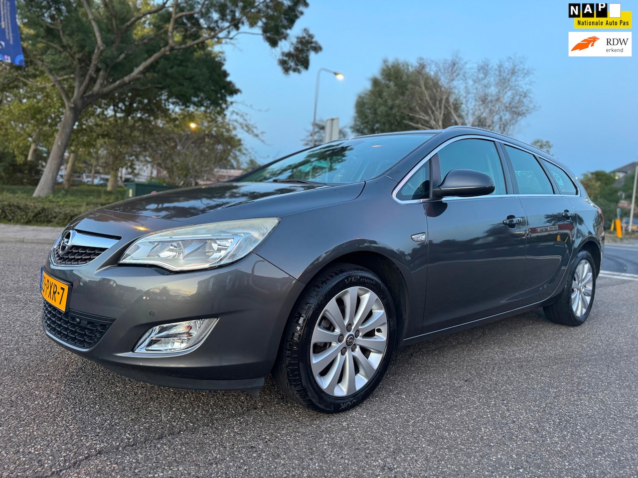 Opel Astra Sports Tourer - 1.4 Cosmo / airco / cruise.control / pdc / elek.pakket / lmv / nap.... - AutoWereld.nl