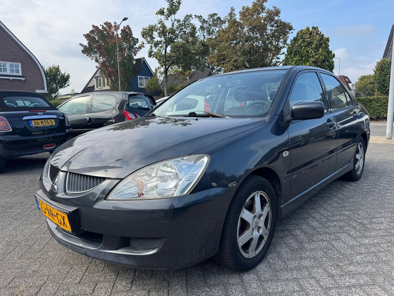 Mitsubishi Lancer - 1.6 Comfort 1.6 Comfort 98pk,Apk 8/7/27,Airco,Elek-pakket,Trekhaak - AutoWereld.nl