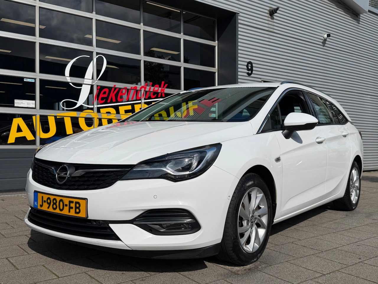 Opel Astra Sports Tourer - 1.2 Turbo Elegance - Navigatie I Airco I LED I PDC I Sport velgen I Leer/ Alcantara Dealer - AutoWereld.nl